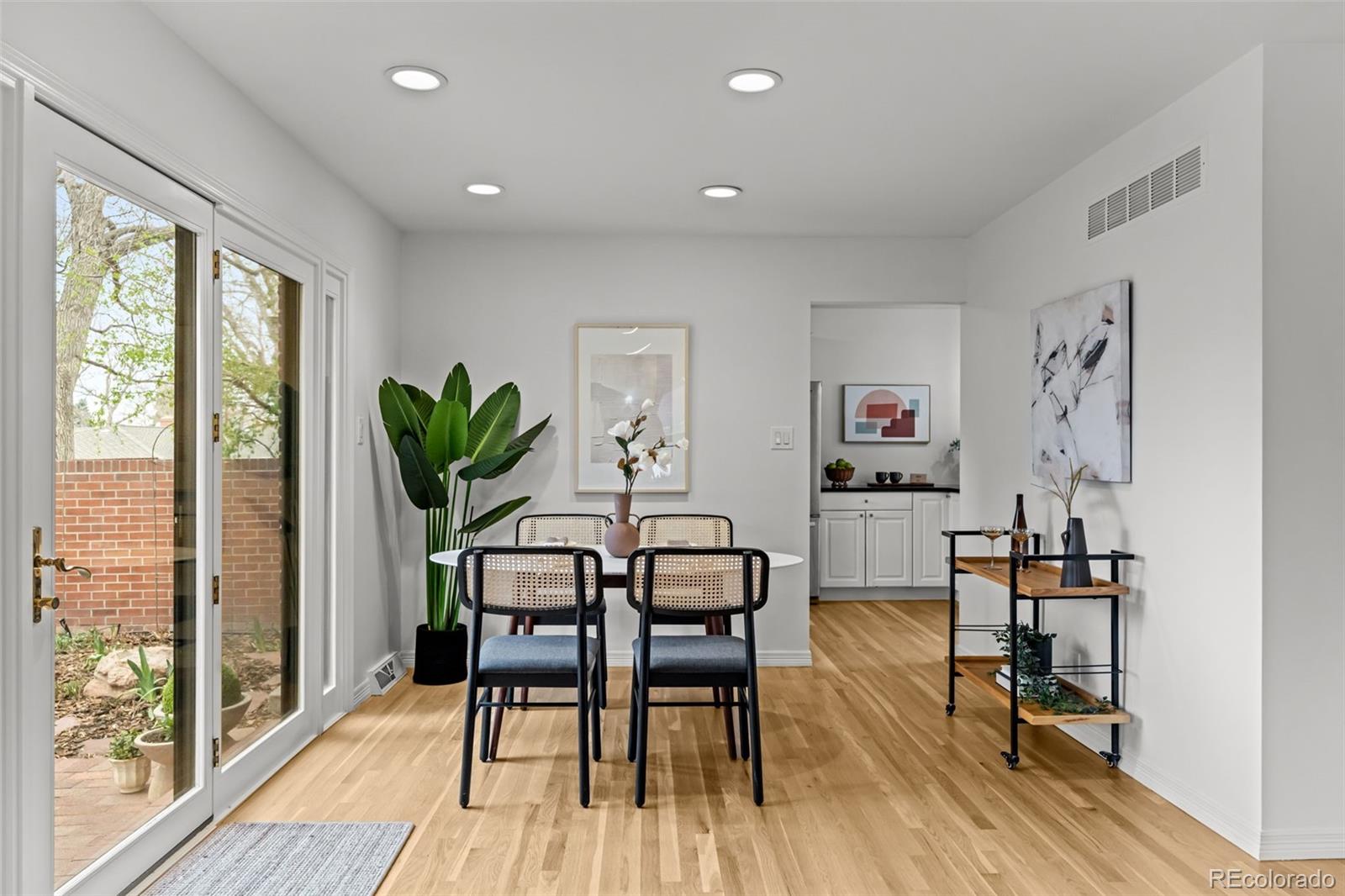 3436 South Race Street Englewood, CO 80113 - Photo 11 of 49 a view of a workspace with furniture and a potted plant