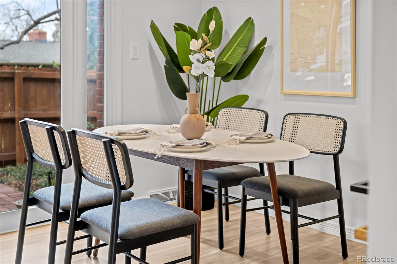3436 South Race Street Englewood, CO 80113 - Photo 12 of 49 a view of a dining room with furniture and wooden floor