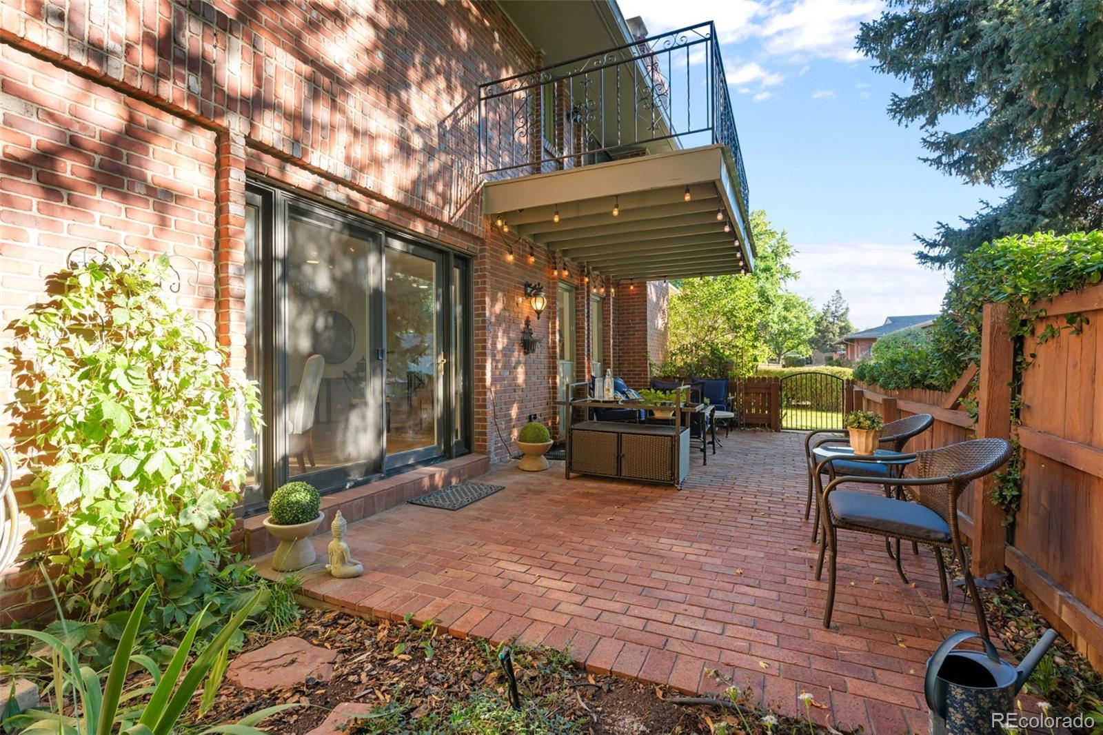 3436 South Race Street Englewood, CO 80113 - Photo 14 of 49 a view of a chairs and tables in the patio