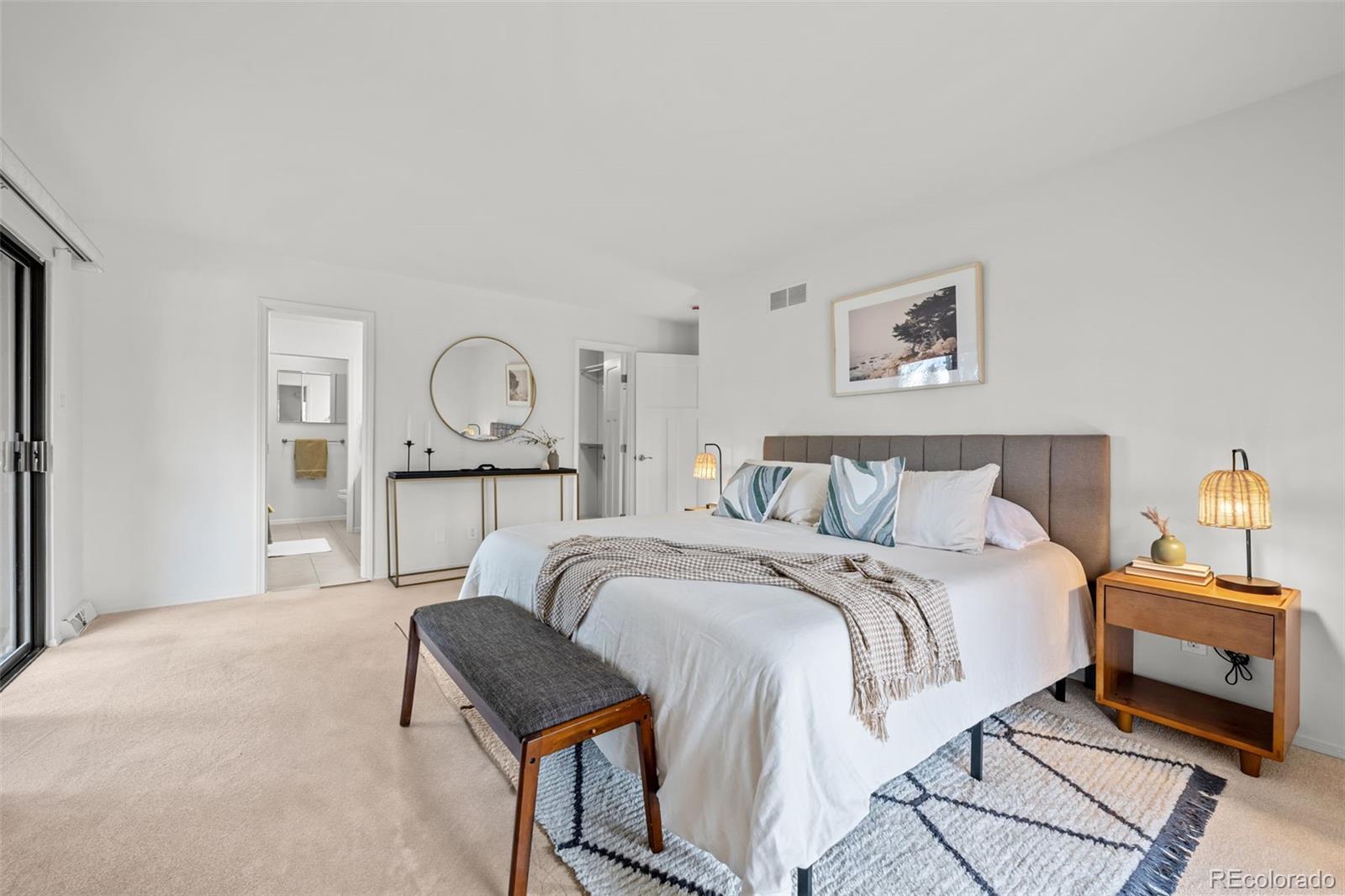 3436 South Race Street Englewood, CO 80113 - Photo 26 of 49 a bed room with a bed and painting on the wall