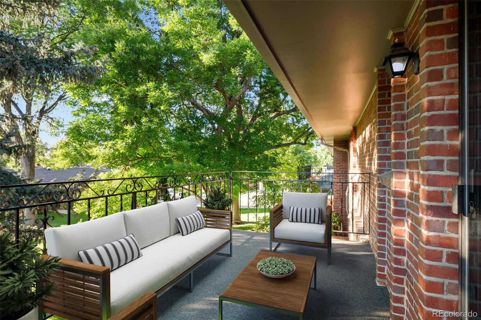 3436 South Race Street Englewood, CO 80113 - Photo 27 of 49 a balcony with couch and a potted plant