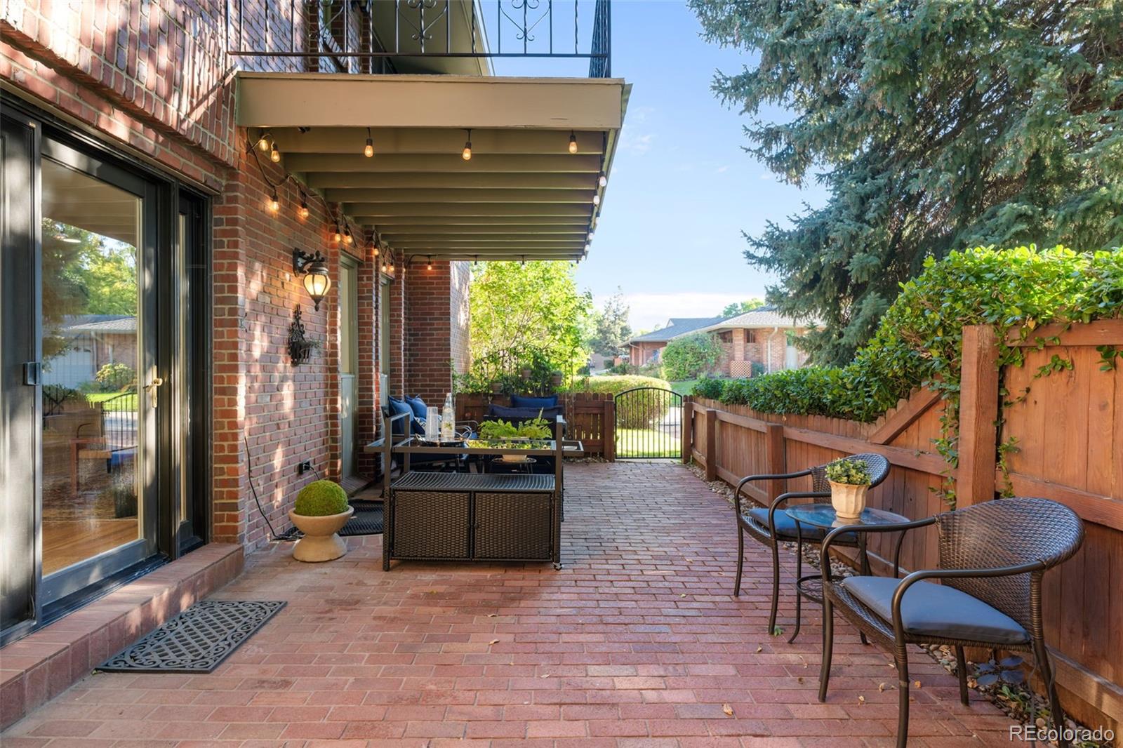 3436 South Race Street Englewood, CO 80113 - Photo 39 of 49 a patio with glass top table and chairs