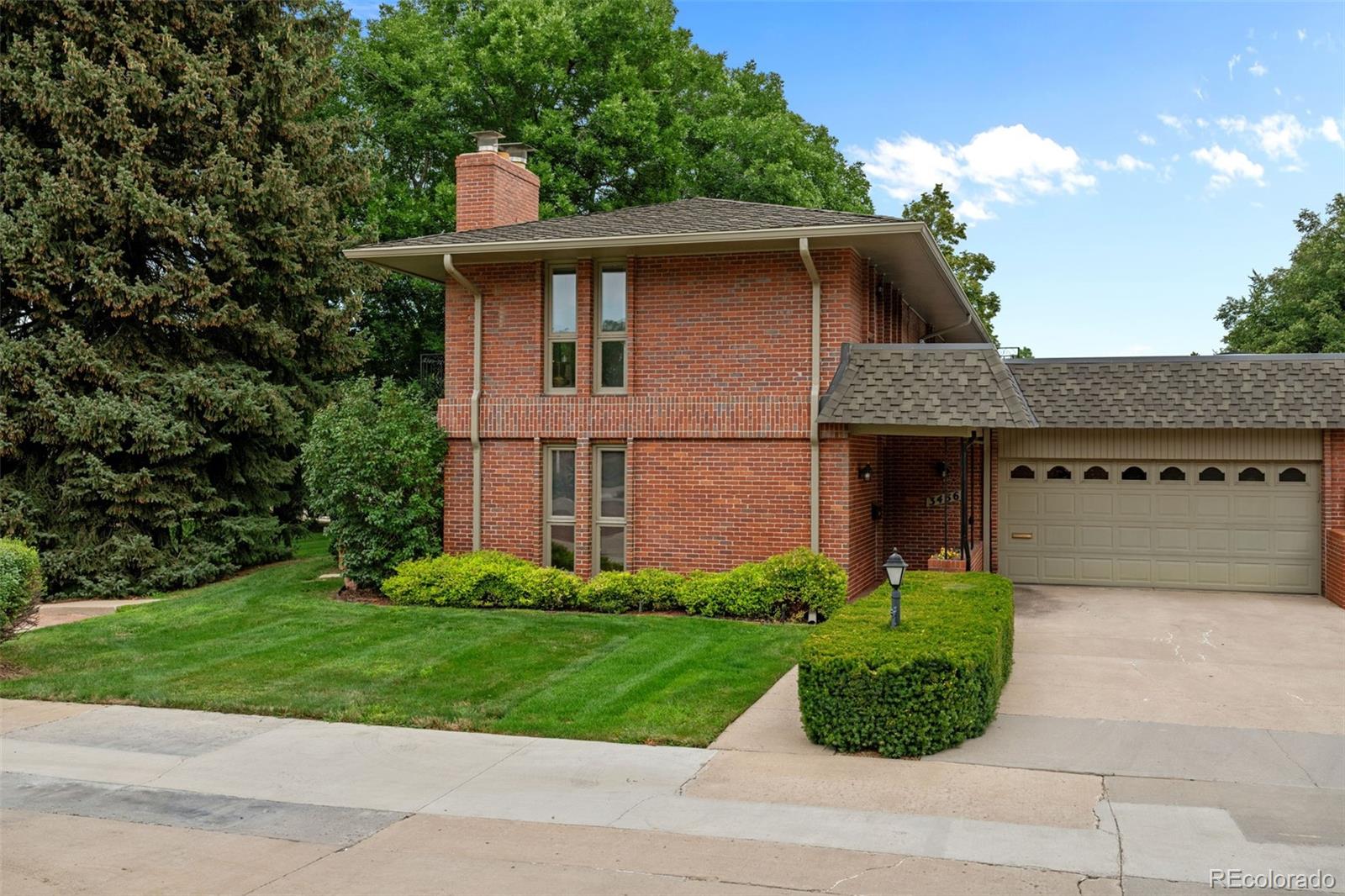 3436 South Race Street Englewood, CO 80113 - Photo 4 of 49 a front view of a house with a yard