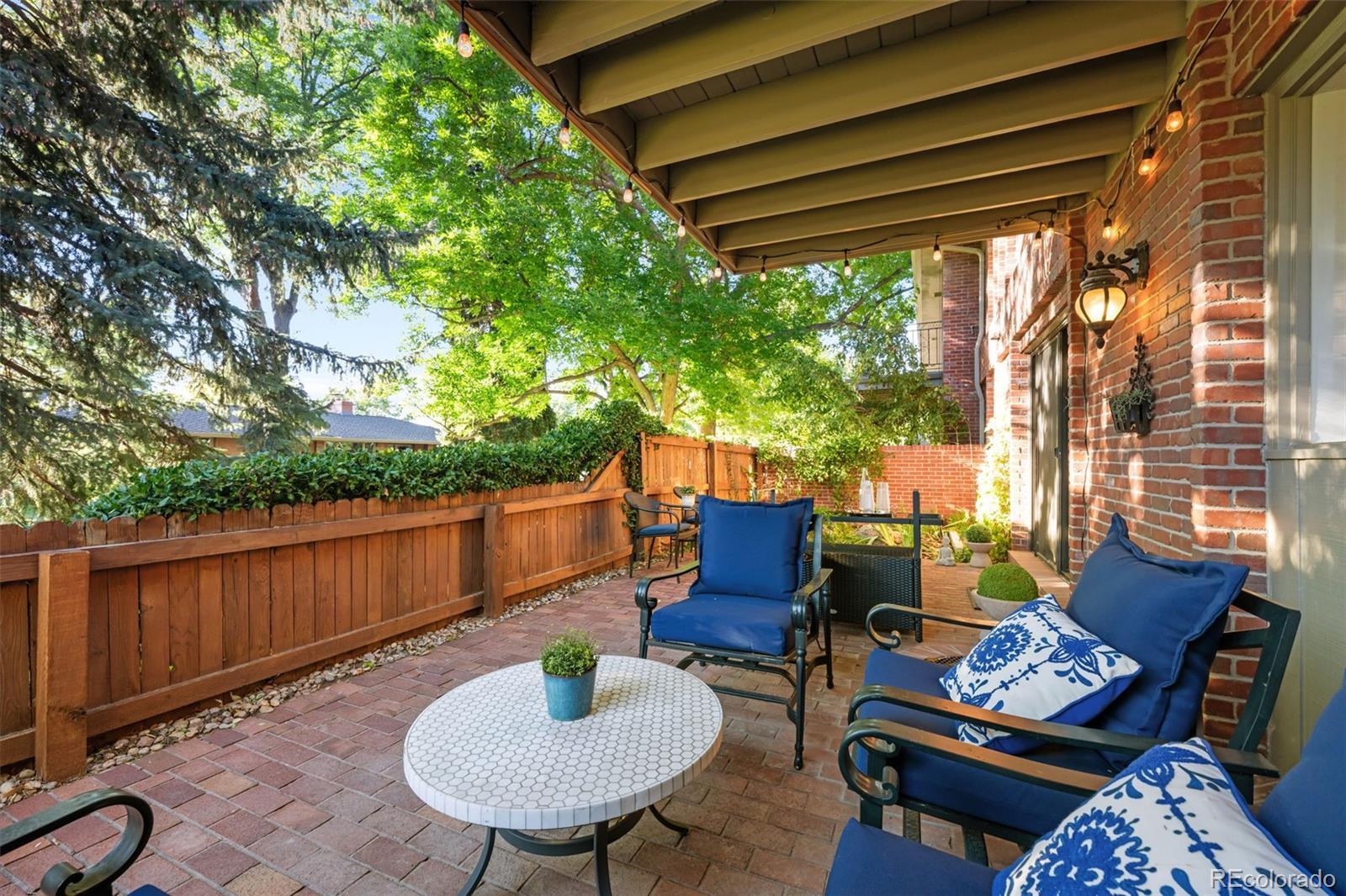 3436 South Race Street Englewood, CO 80113 - Photo 41 of 49 a backyard of a house with table and chairs