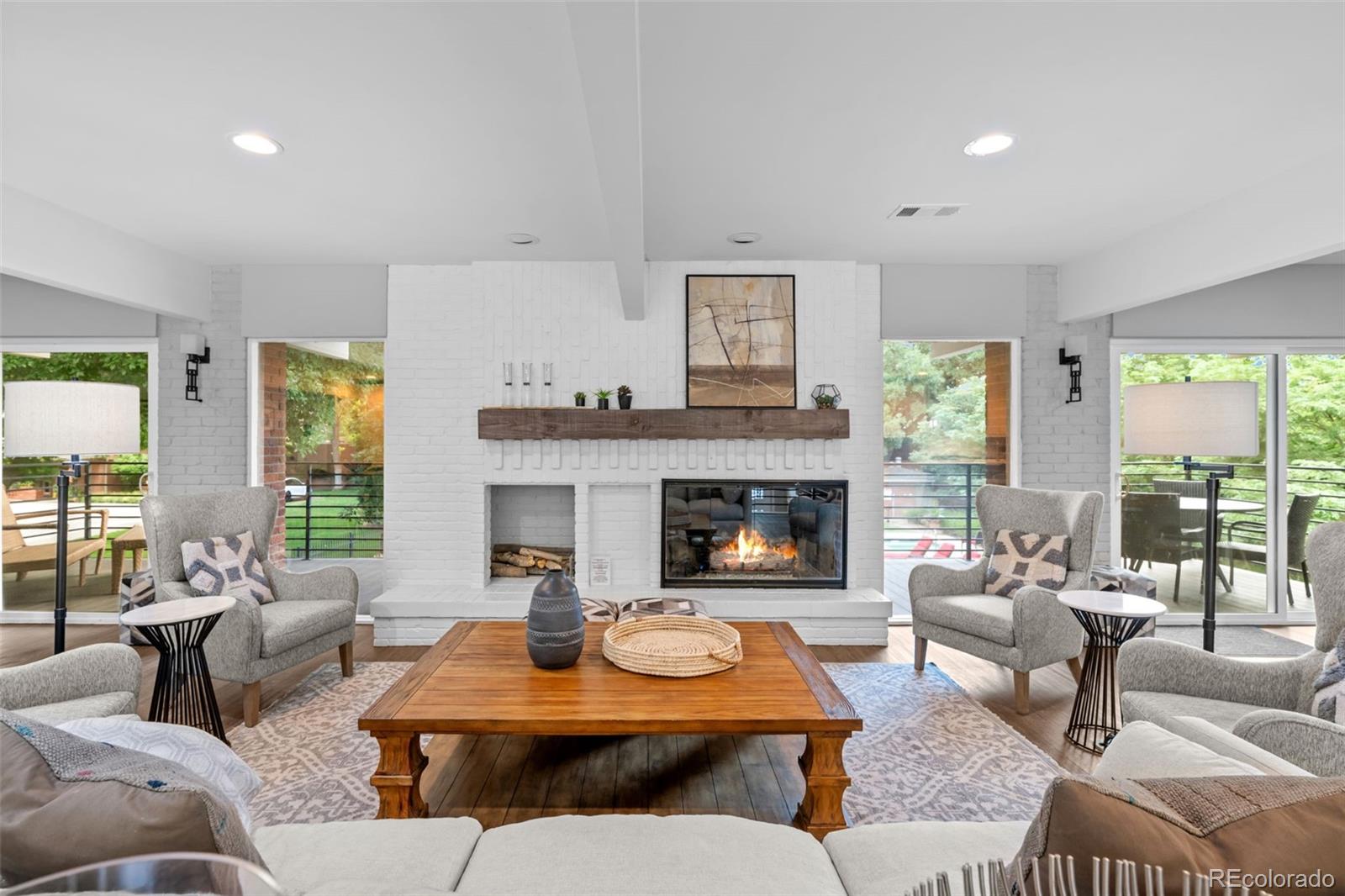 3436 South Race Street Englewood, CO 80113 - Photo 42 of 49 a living room with furniture and a fireplace