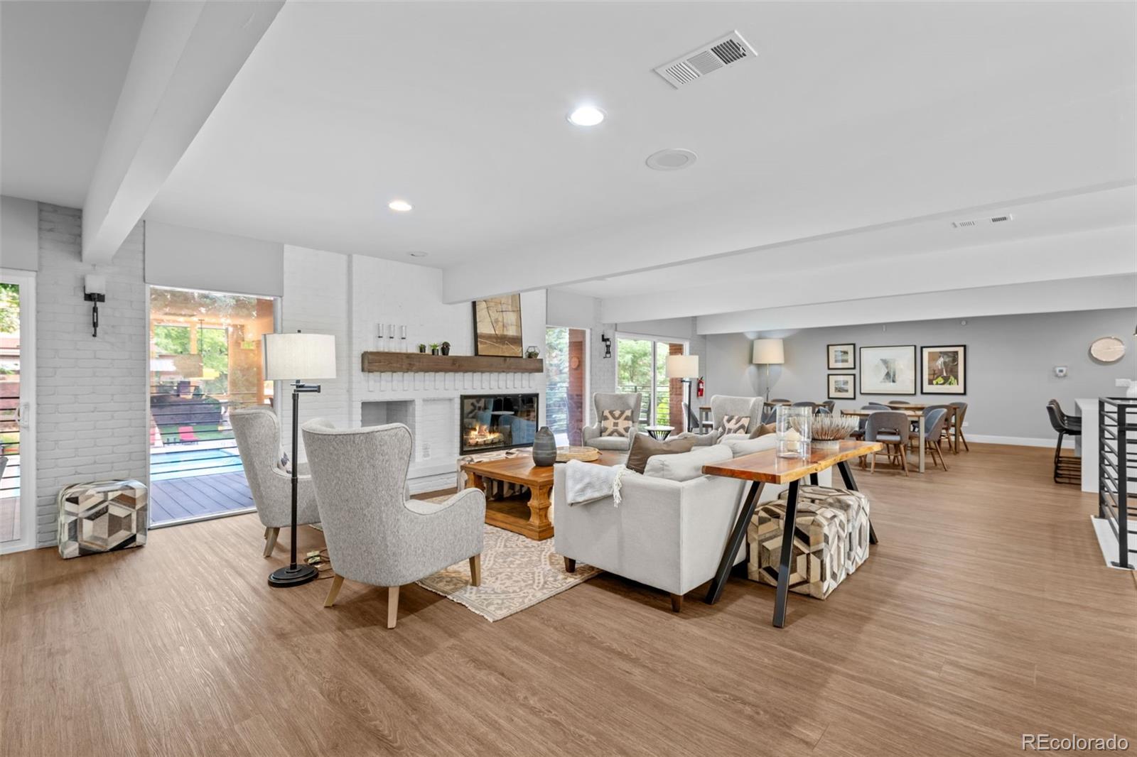 3436 South Race Street Englewood, CO 80113 - Photo 43 of 49 a living room with fireplace furniture and a wooden floor