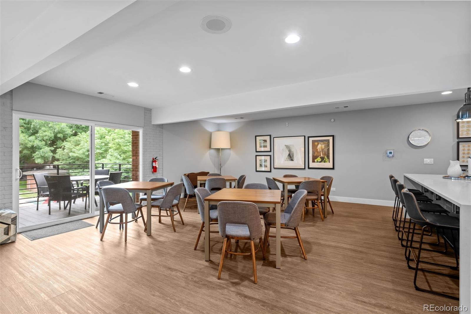 3436 South Race Street Englewood, CO 80113 - Photo 45 of 49 a view of a dining room with furniture and wooden floor