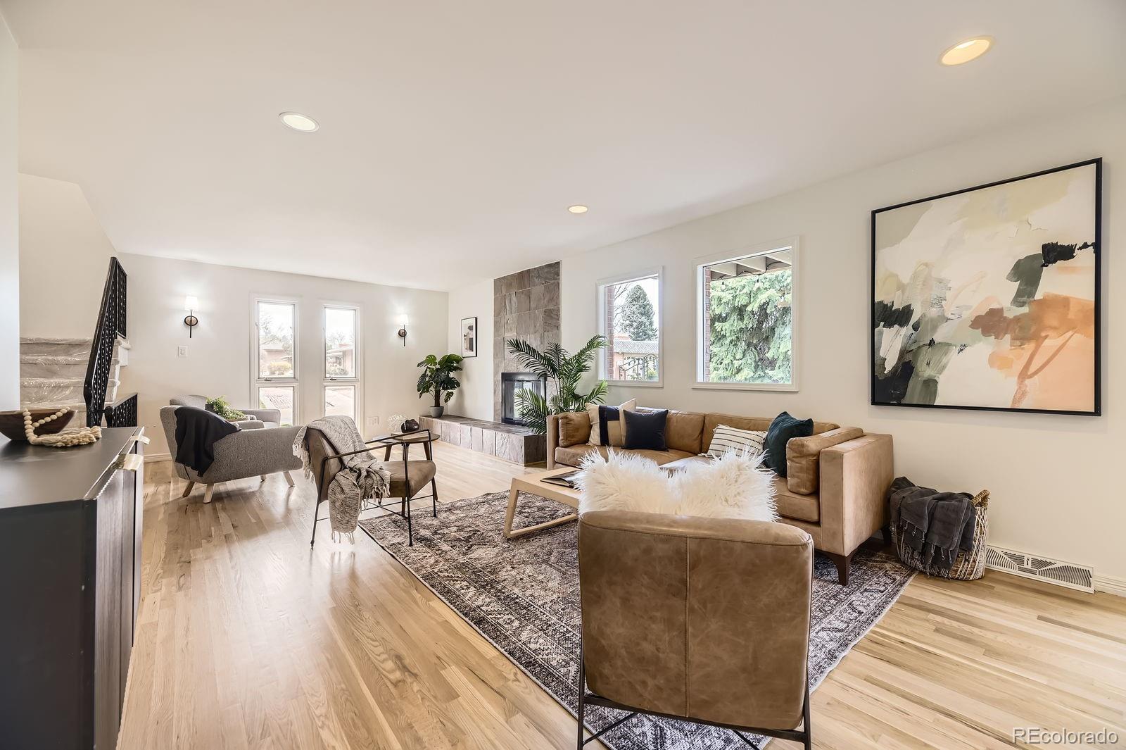 3436 South Race Street Englewood, CO 80113 - Photo 5 of 49 a living room with furniture and wooden floor