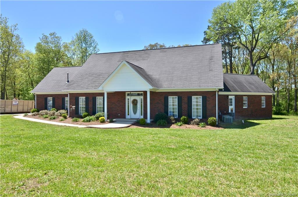 5208 Austin Road Monroe, NC 28112 - Photo 2 of 36 a front view of a house with a yard and porch