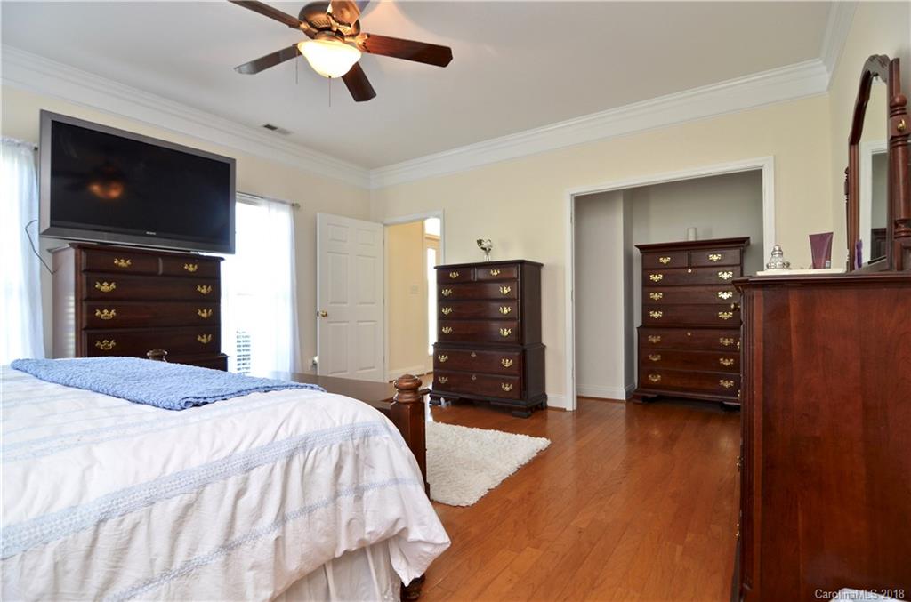 5208 Austin Road Monroe, NC 28112 - Photo 14 of 36 a bedroom with a bed and a television