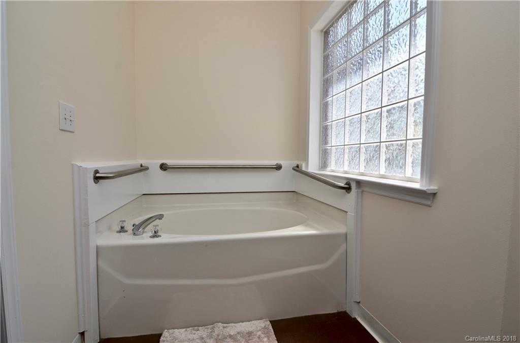 5208 Austin Road Monroe, NC 28112 - Photo 17 of 36 a bathroom with a bathtub