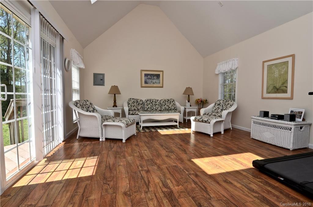 5208 Austin Road Monroe, NC 28112 - Photo 18 of 36 a living room with furniture and a wooden floor