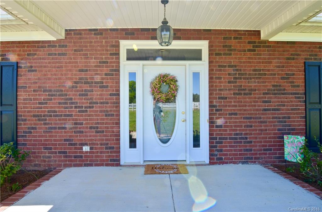 5208 Austin Road Monroe, NC 28112 - Photo 3 of 36 a front view of a house with garden