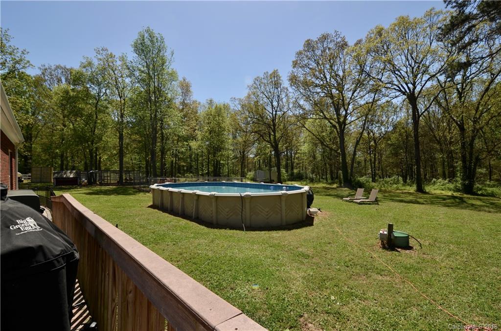 5208 Austin Road Monroe, NC 28112 - Photo 25 of 36 a view of a backyard with swimming pool