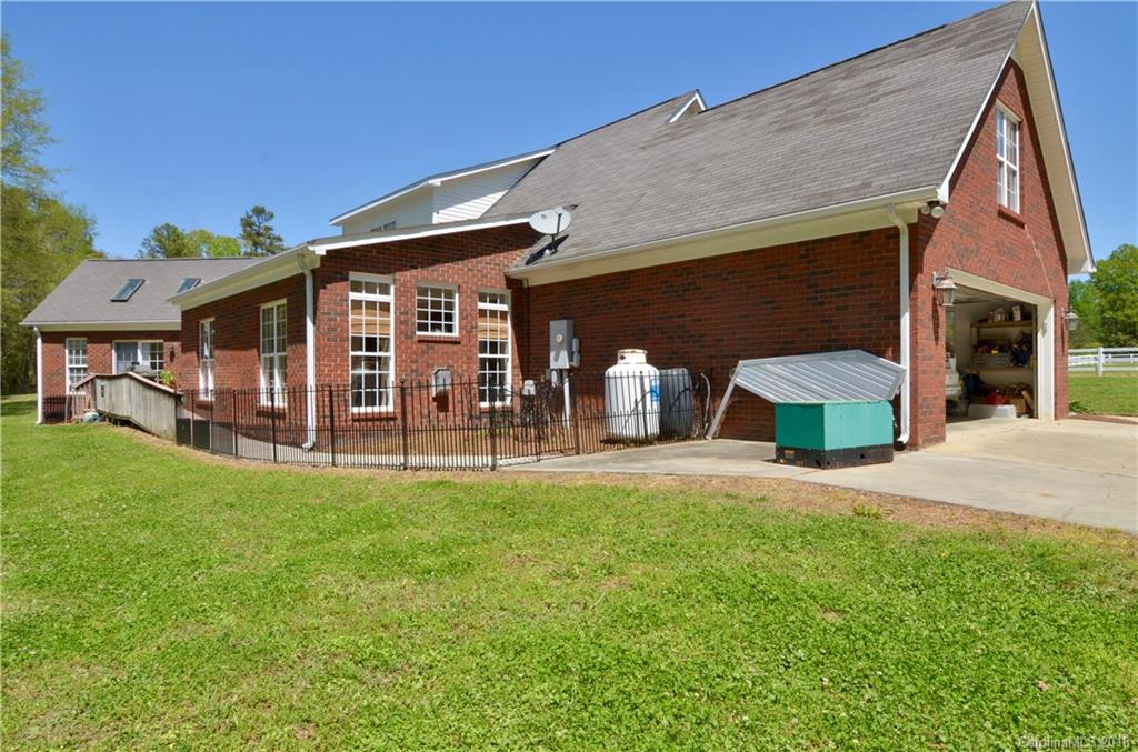 5208 Austin Road Monroe, NC 28112 - Photo 26 of 36 a view of a house with backyard and porch