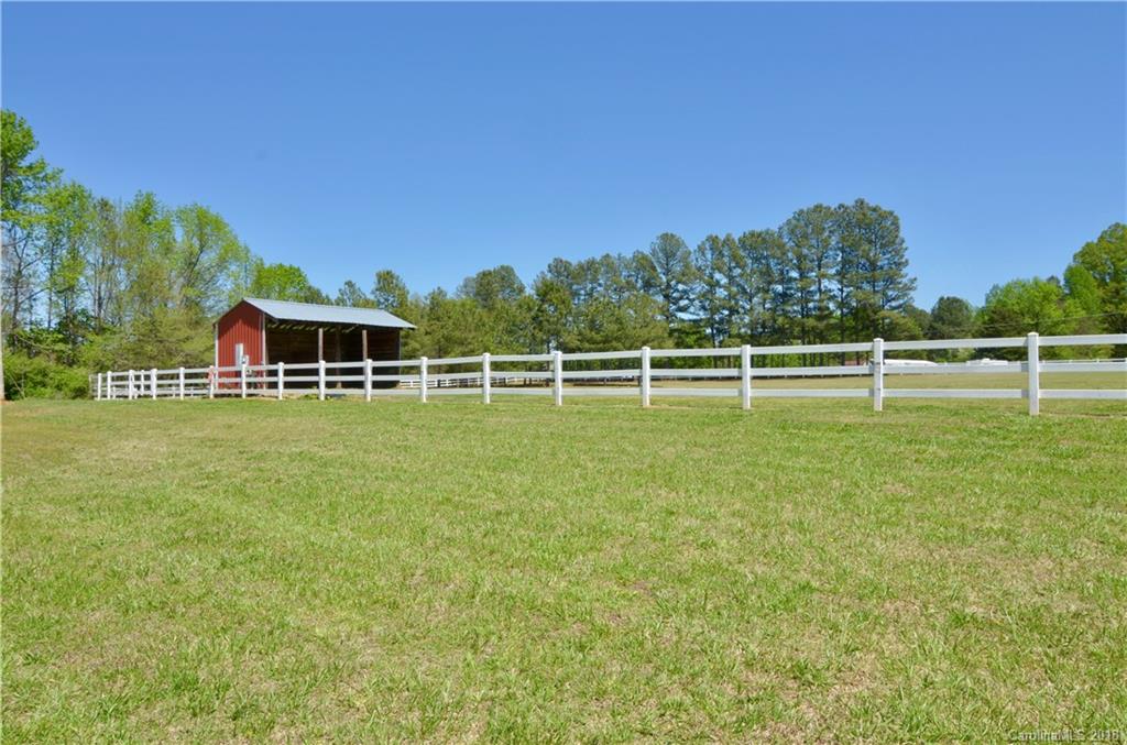 5208 Austin Road Monroe, NC 28112 - Photo 29 of 36 a view of a house with a big yard