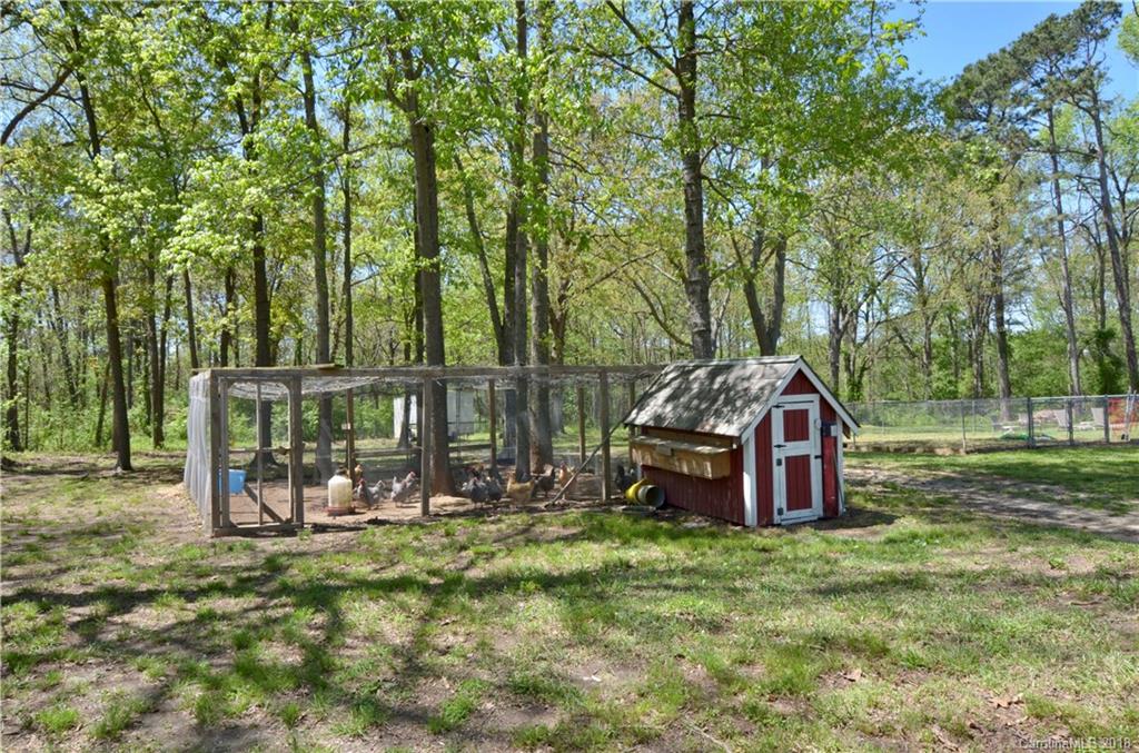 5208 Austin Road Monroe, NC 28112 - Photo 36 of 36 a view of outdoor space with deck and trees
