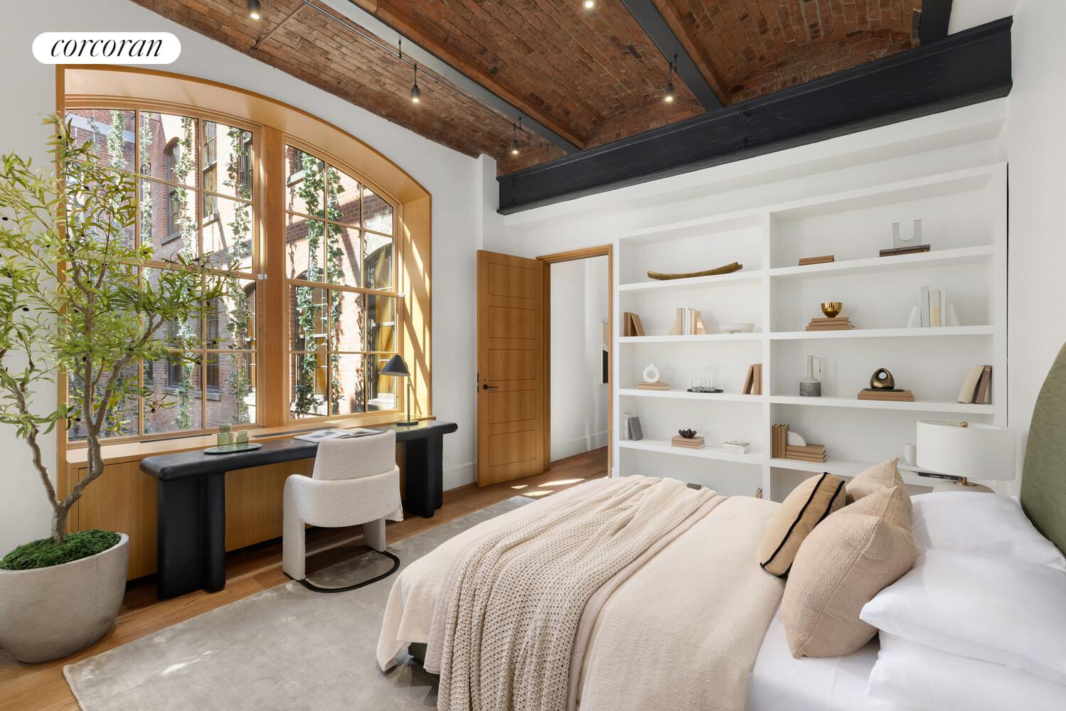36 Bleecker Street, Unit 5A Manhattan, NY 10012 - Photo 10 of 39 a bedroom with a bed and a large window