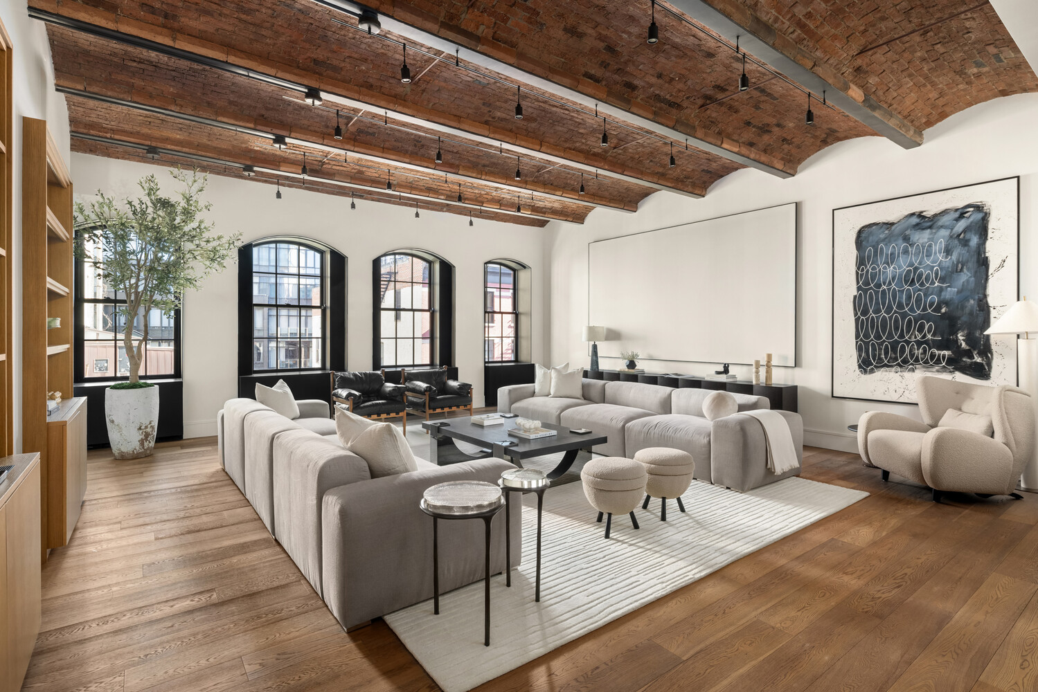 36 Bleecker Street, Unit 5A Manhattan, NY 10012 - Photo 21 of 39 a living room with furniture and a large window