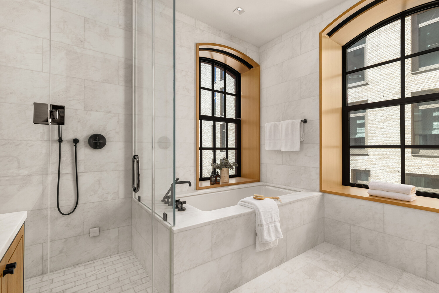 36 Bleecker Street, Unit 5A Manhattan, NY 10012 - Photo 26 of 39 a bathroom with a tub a sink and a window