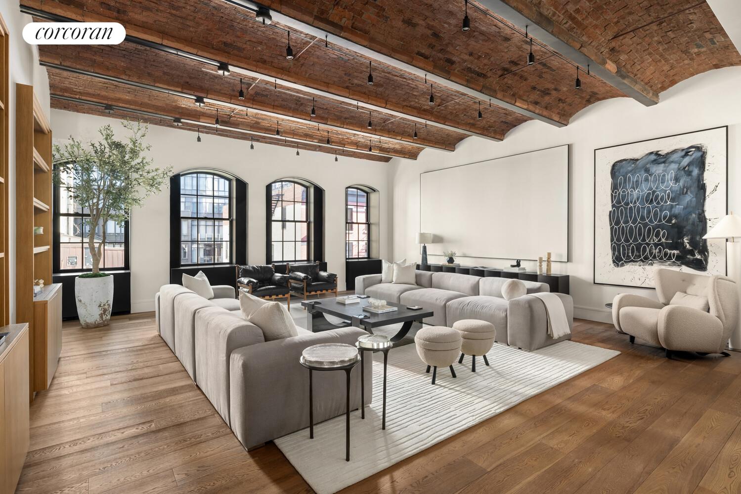 36 Bleecker Street, Unit 5A Manhattan, NY 10012 - Photo 2 of 39 a living room with furniture and a large window