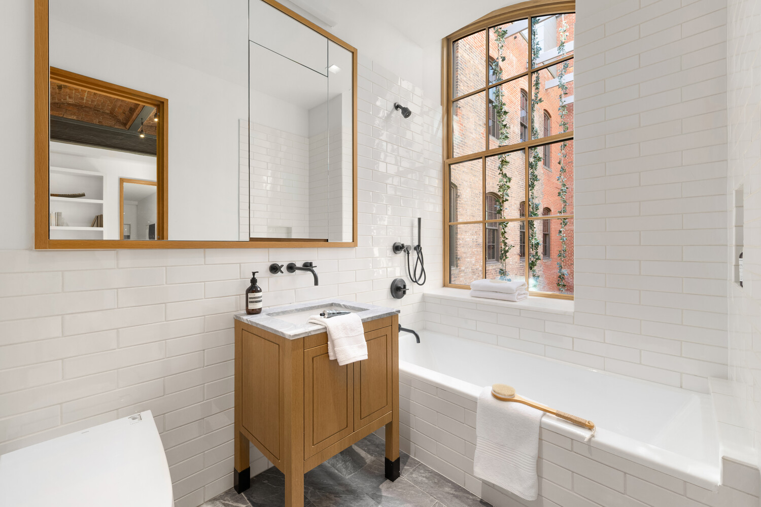 36 Bleecker Street, Unit 5A Manhattan, NY 10012 - Photo 30 of 39 a bathroom with a sink and a bathtub