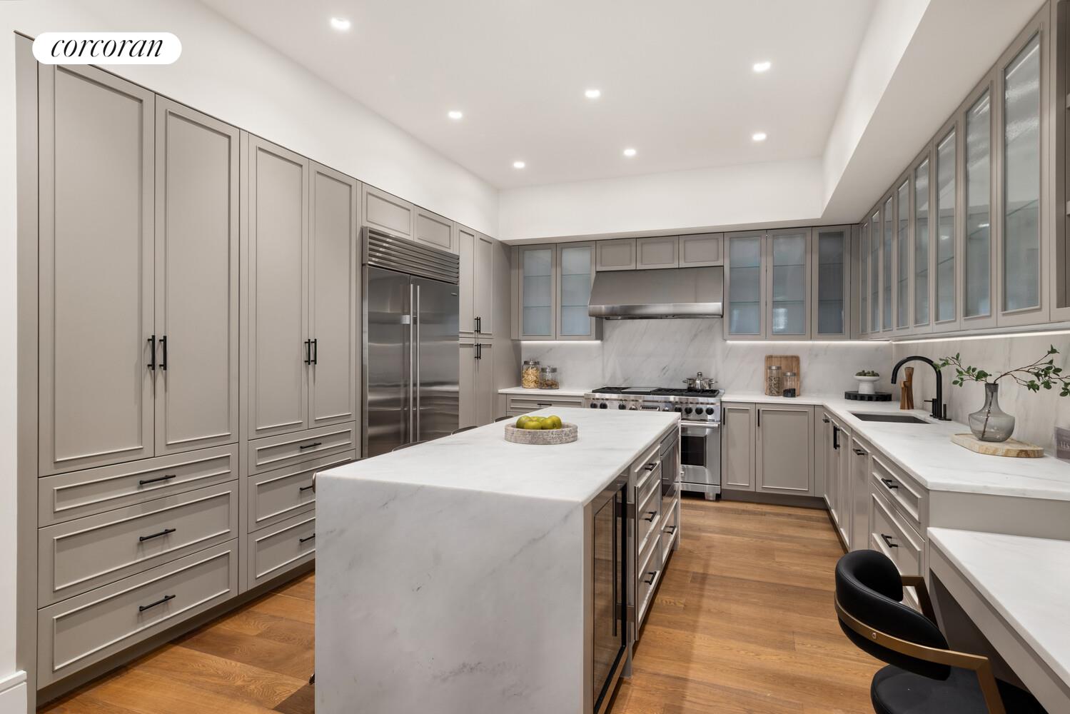 36 Bleecker Street, Unit 5A Manhattan, NY 10012 - Photo 5 of 39 a kitchen with a sink stove and cabinets