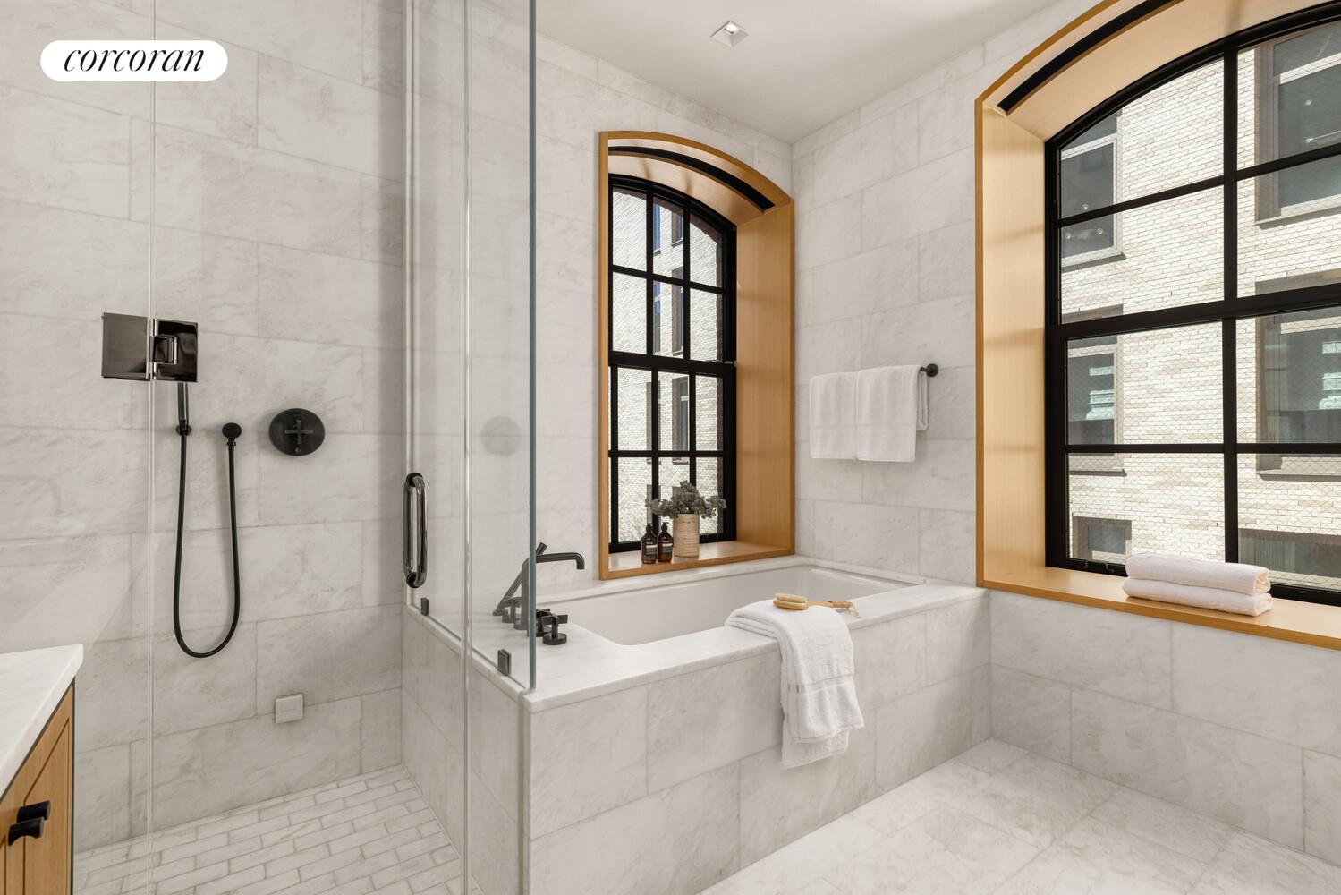 36 Bleecker Street, Unit 5A Manhattan, NY 10012 - Photo 7 of 39 a bathroom with a tub a sink and a shower