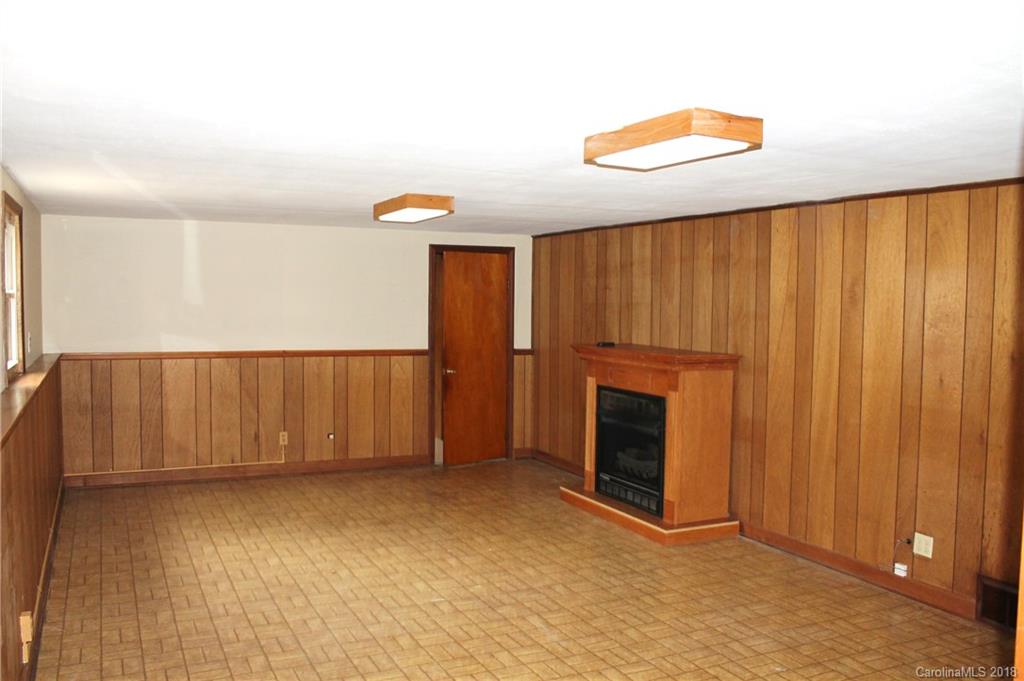 4335 Beaty Road Gastonia, NC 28056 - Photo 11 of 22 a view of an empty room with wooden floor and a window