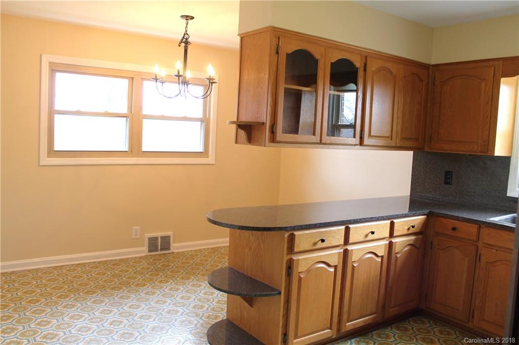 4335 Beaty Road Gastonia, NC 28056 - Photo 6 of 22 a view of a kitchen with stainless steel appliances granite countertop a sink and cabinets