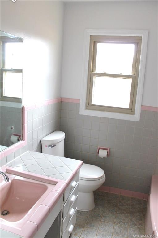 4335 Beaty Road Gastonia, NC 28056 - Photo 9 of 22 a bathroom with a toilet sink and window