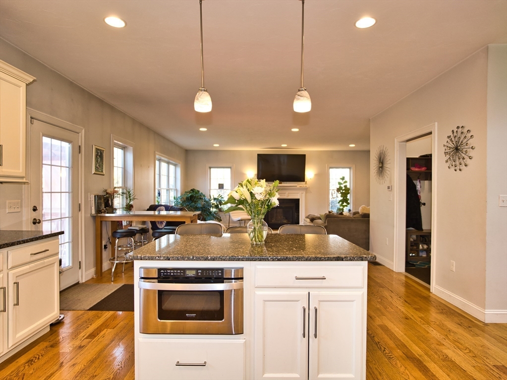 9 Brookfield Lane Bellingham, MA 02019 - Photo 14 of 40 a kitchen with stainless steel appliances granite countertop a sink and stove
