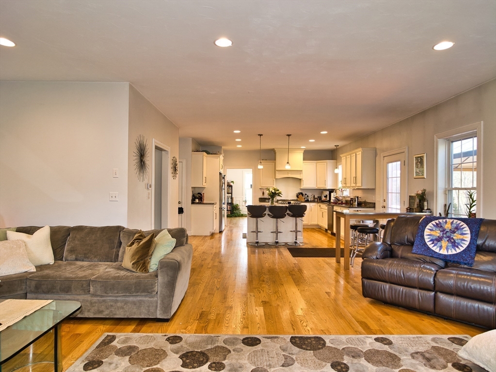 9 Brookfield Lane Bellingham, MA 02019 - Photo 15 of 40 a living room with furniture and a table