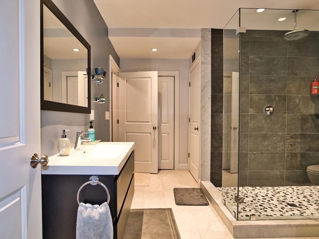 9 Brookfield Lane Bellingham, MA 02019 - Photo 19 of 40 a bathroom with a sink and a mirror