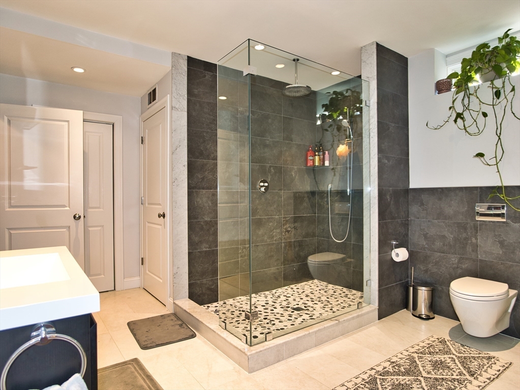 9 Brookfield Lane Bellingham, MA 02019 - Photo 20 of 40 a bathroom with a sink a toilet and shower