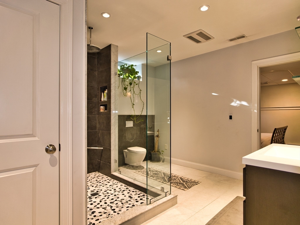 9 Brookfield Lane Bellingham, MA 02019 - Photo 21 of 40 a bathroom with a shower and a sink