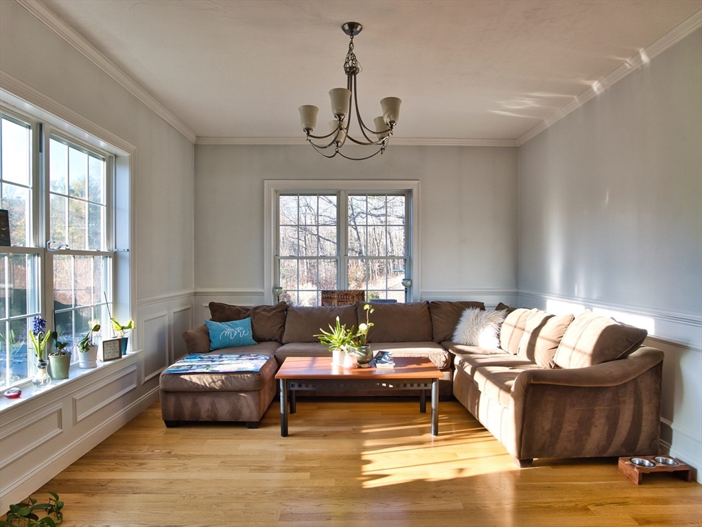9 Brookfield Lane Bellingham, MA 02019 - Photo 22 of 40 a living room with furniture and a large window