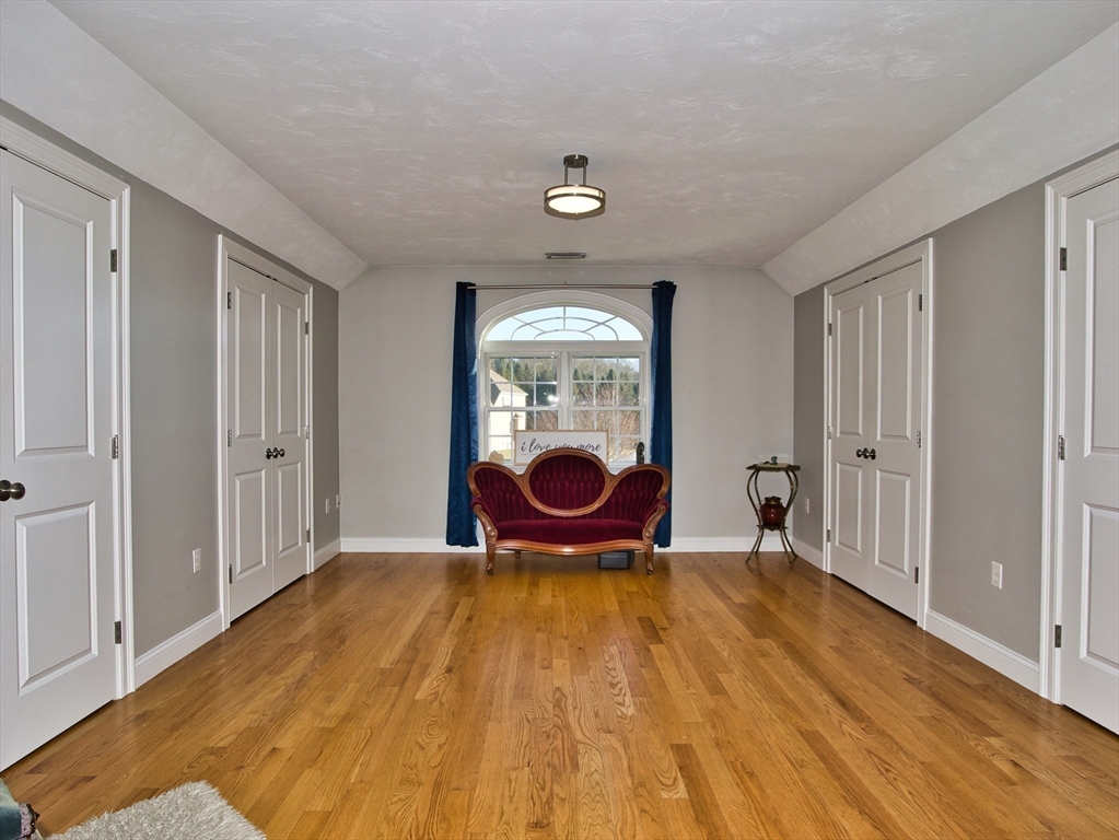 9 Brookfield Lane Bellingham, MA 02019 - Photo 27 of 40 a view of a room with wooden floor and windows