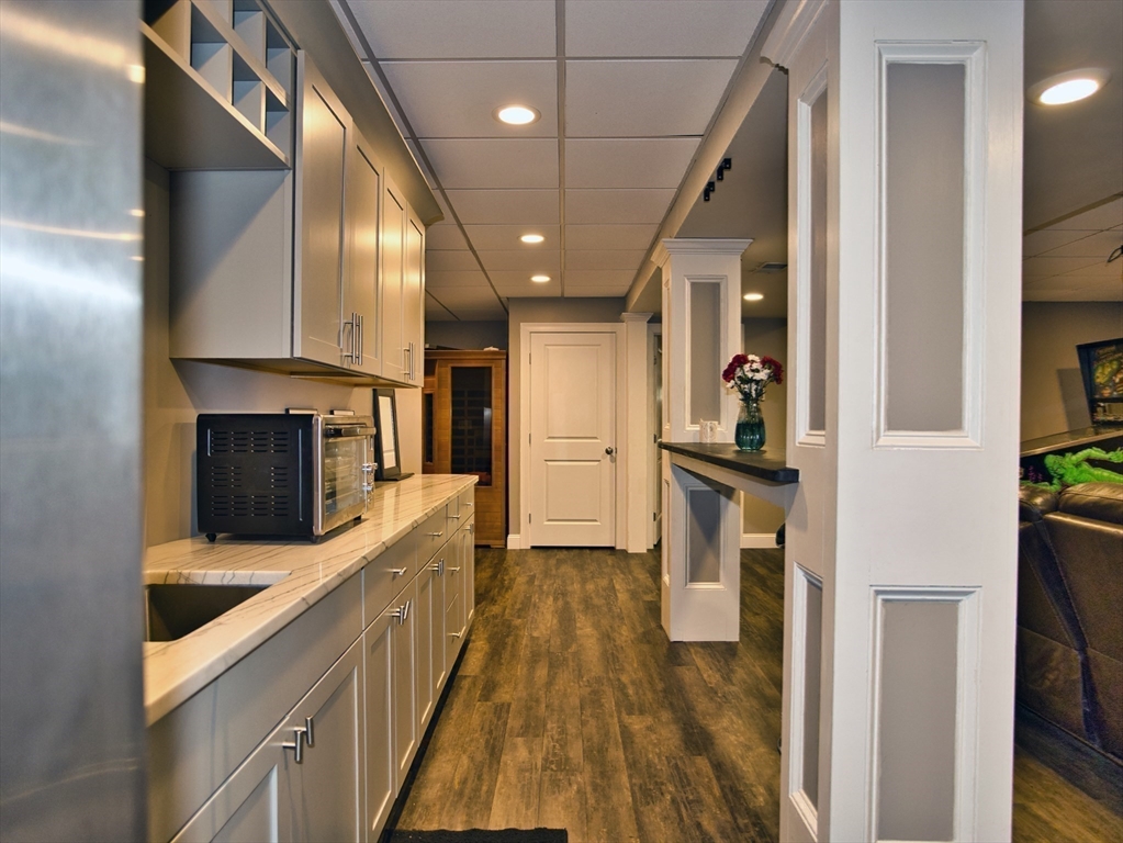9 Brookfield Lane Bellingham, MA 02019 - Photo 32 of 40 a kitchen with granite countertop a stove and a refrigerator