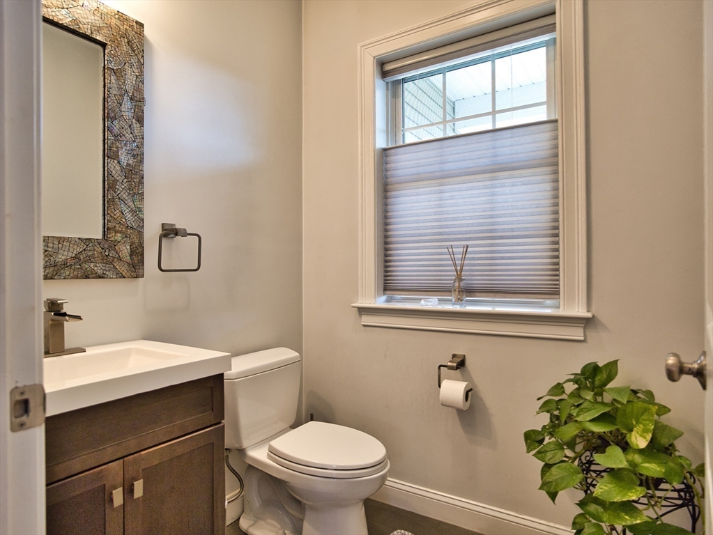 9 Brookfield Lane Bellingham, MA 02019 - Photo 35 of 40 a bathroom with a toilet sink and mirror