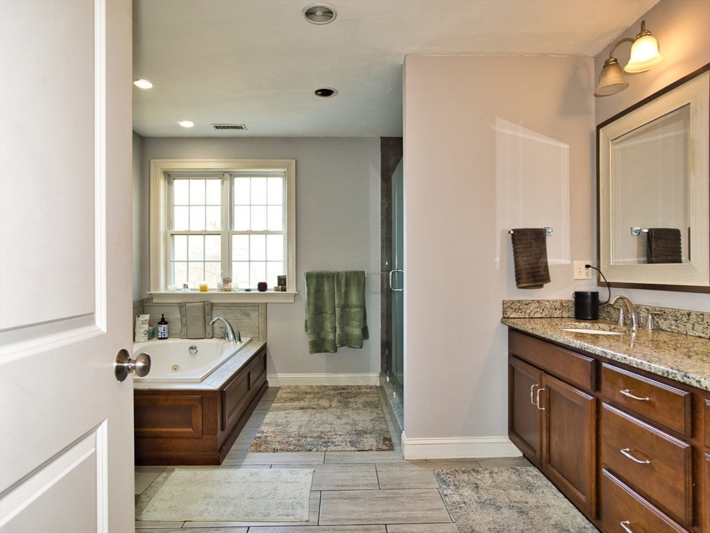 9 Brookfield Lane Bellingham, MA 02019 - Photo 36 of 40 a spacious bathroom with a tub sink and mirror