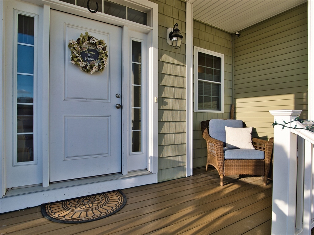 9 Brookfield Lane Bellingham, MA 02019 - Photo 6 of 40 a view of a door with wooden bench