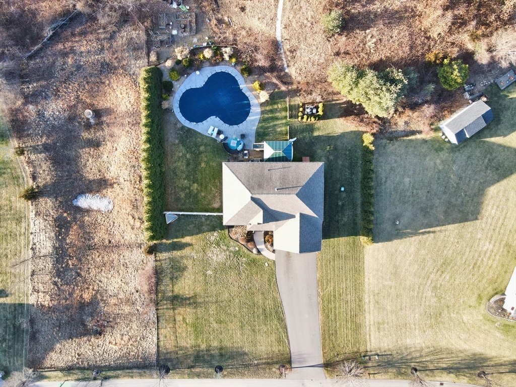 9 Brookfield Lane Bellingham, MA 02019 - Photo 7 of 40 a view of a house with a backyard and a tree