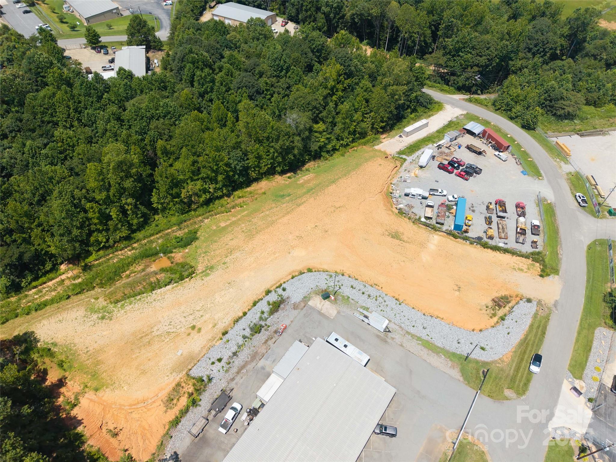 0 Denver Industrial Park Road Denver, NC 28037 - Photo 15 of 17 an aerial view of a house a yard and mountain view in back