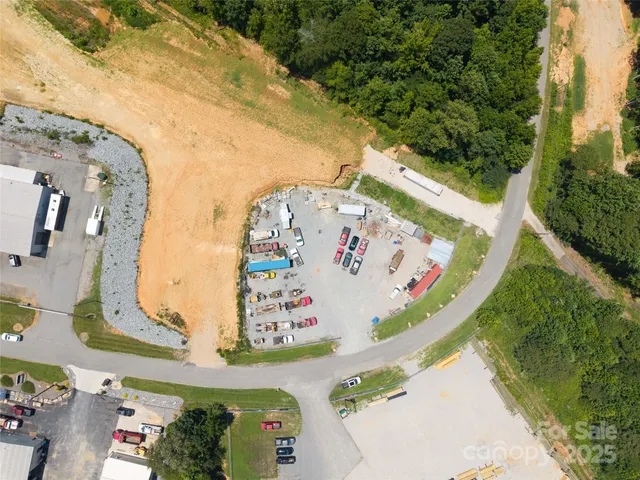 an aerial view of a house a swimming pool