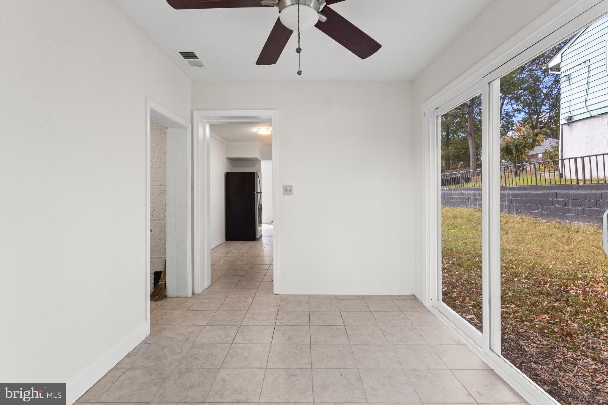 5120 Kenesaw Street College Park, MD 20740 - Photo 16 of 37 a view of hallway with chandelier fan and window