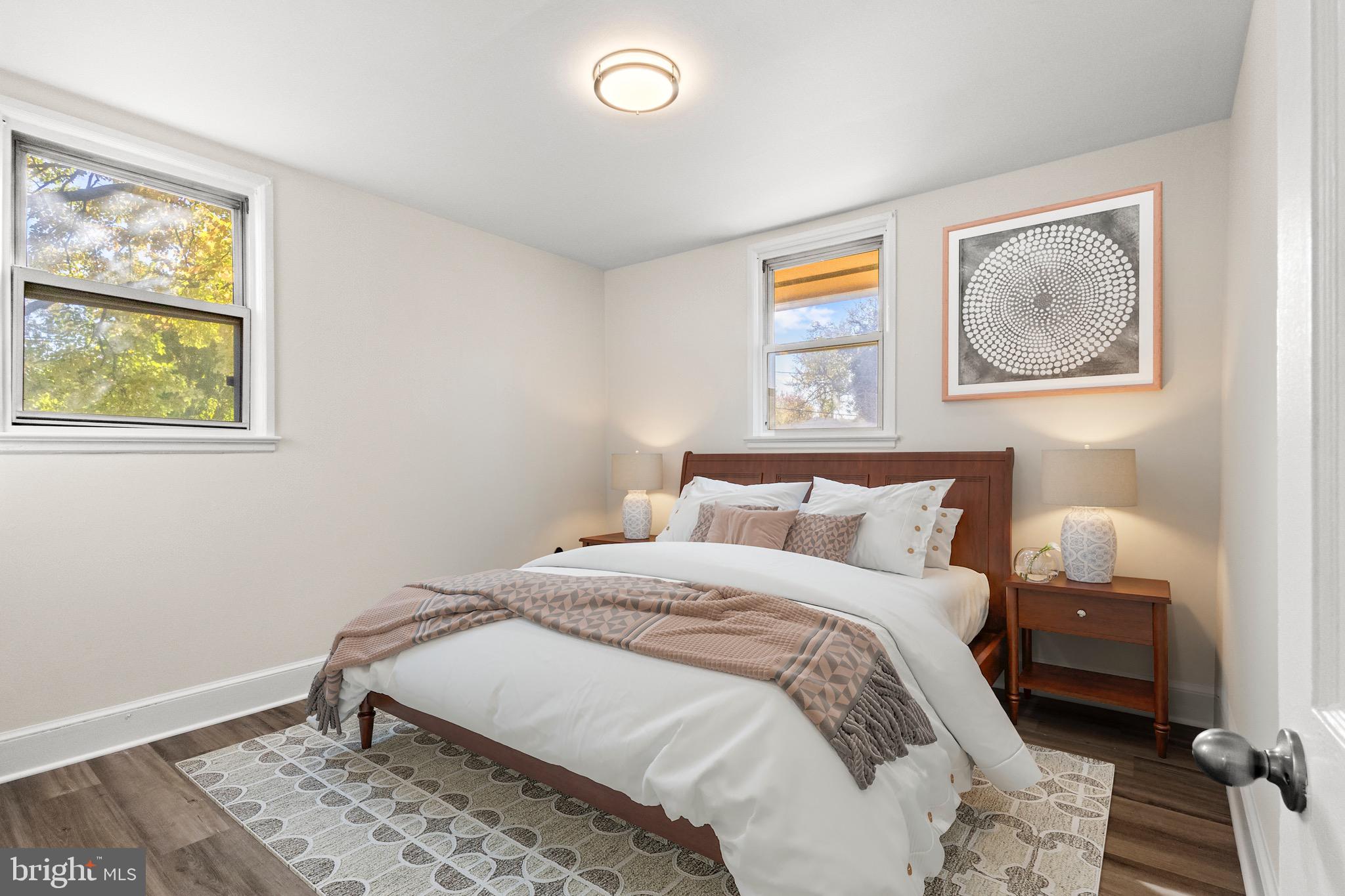 5120 Kenesaw Street College Park, MD 20740 - Photo 18 of 37 a bedroom with a bed and wooden floor