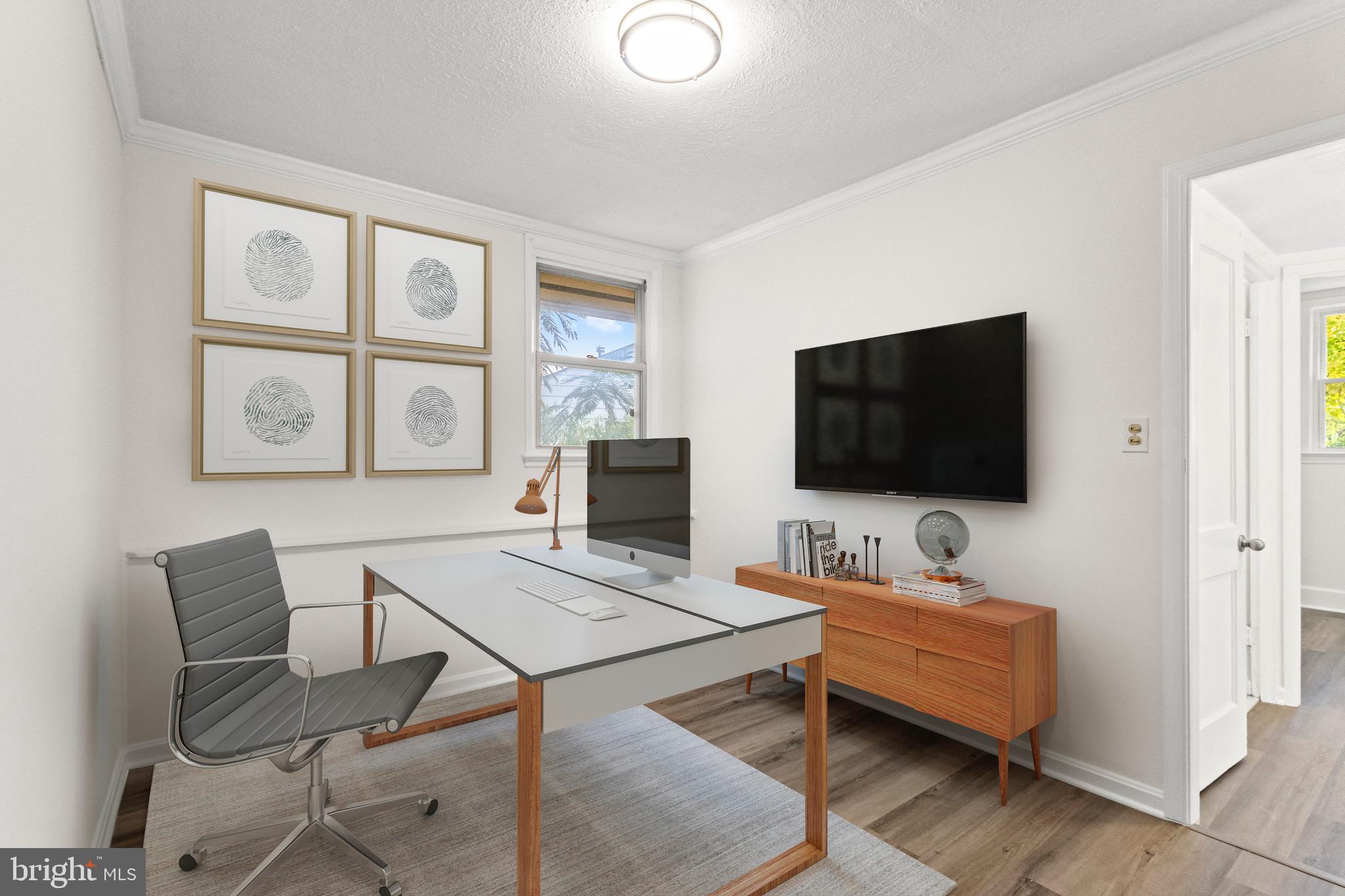 5120 Kenesaw Street College Park, MD 20740 - Photo 24 of 37 a living room with furniture and a flat screen tv