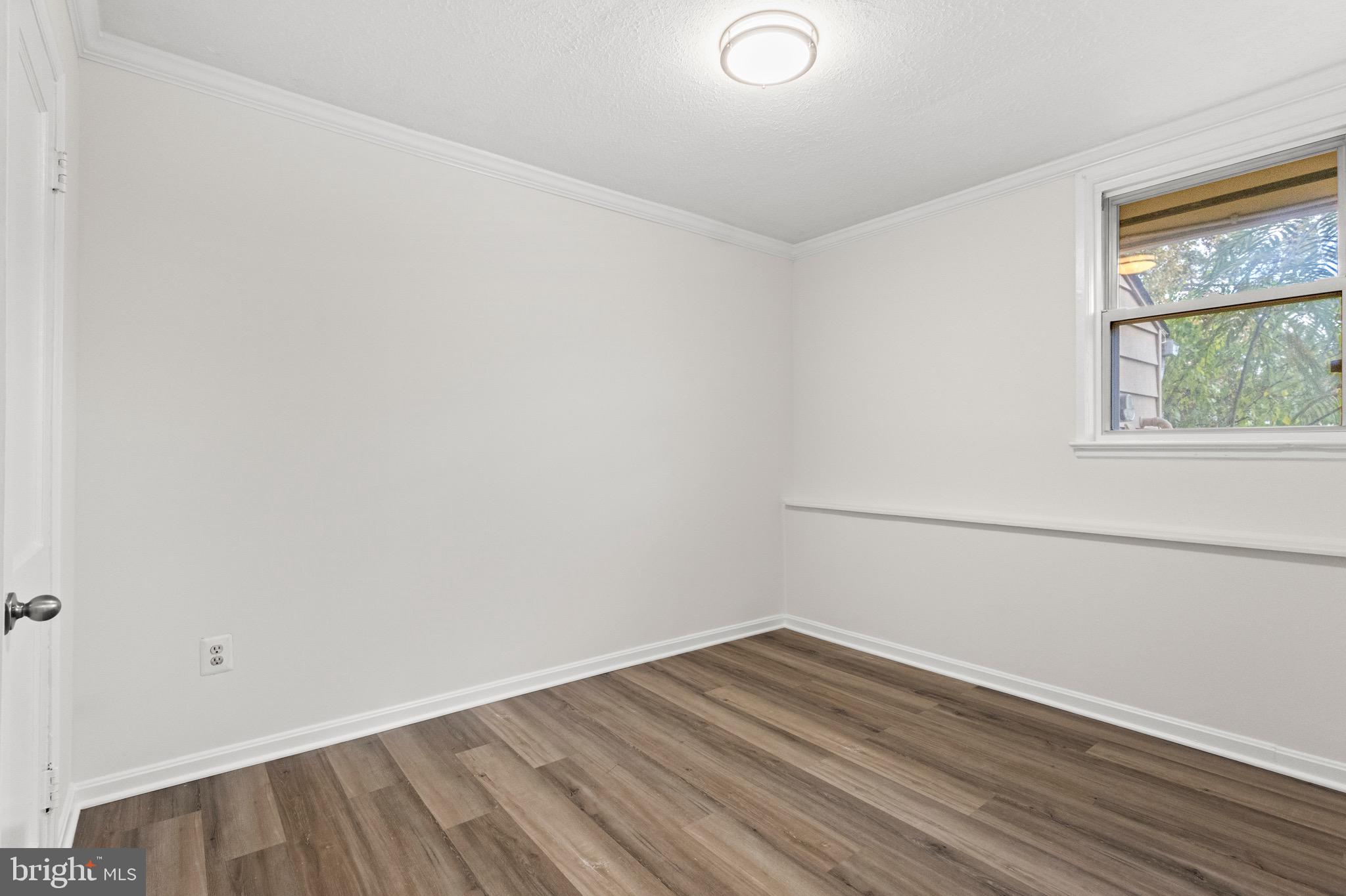 5120 Kenesaw Street College Park, MD 20740 - Photo 26 of 37 an empty room with wooden floor and windows