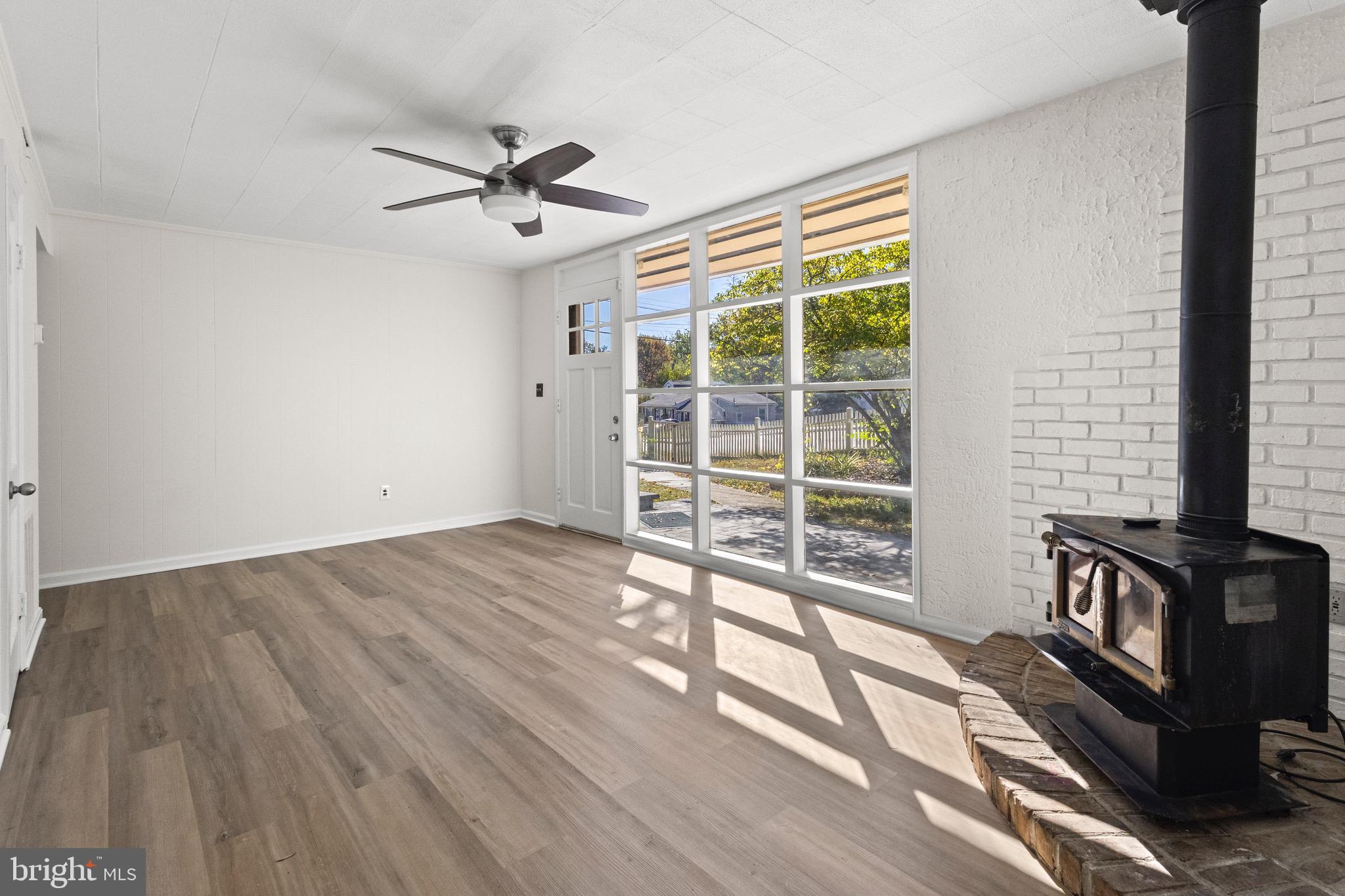 5120 Kenesaw Street College Park, MD 20740 - Photo 7 of 37 a view of a livingroom with wooden floor and a ceiling fan